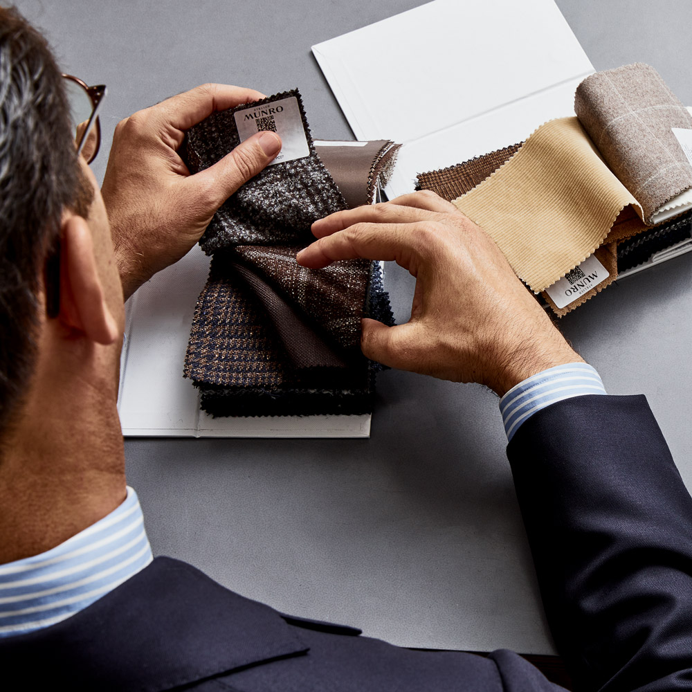 Style Advisor helping a client choose fabrics